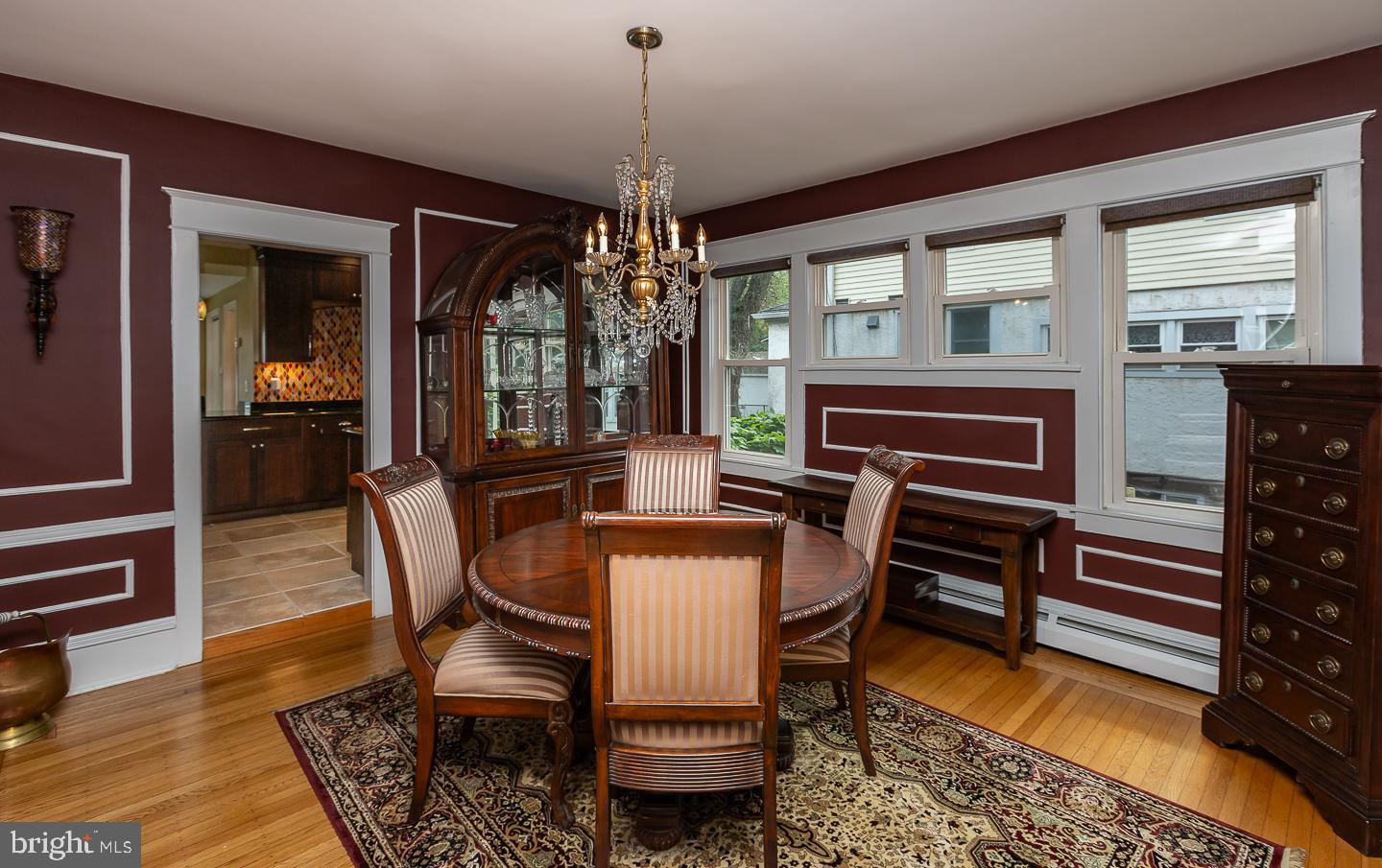 133 Kathmere Road Havertown, PA 19083 - Photo 12 of 45 a dining room with furniture a chandelier and wooden floor