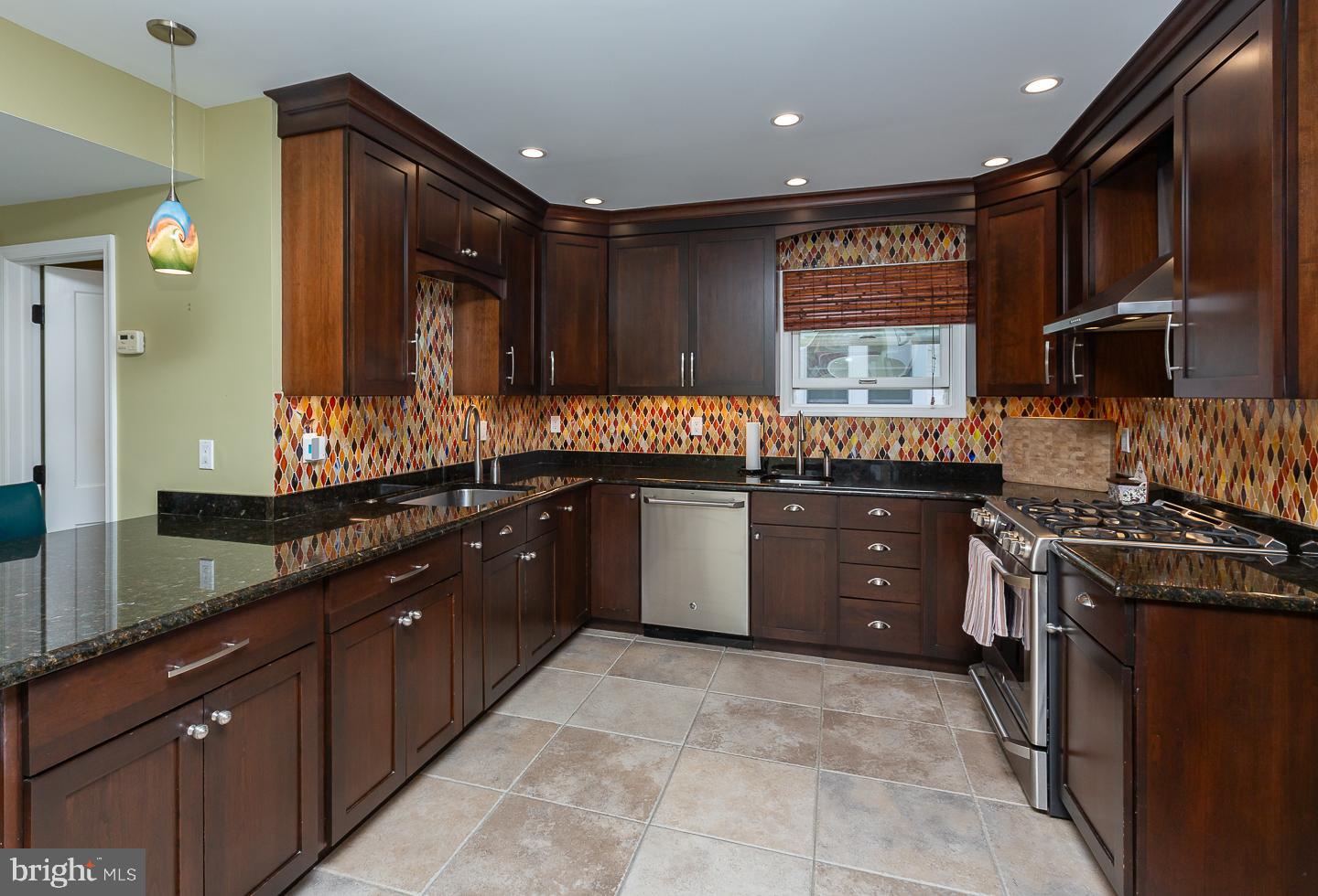 133 Kathmere Road Havertown, PA 19083 - Photo 15 of 45 a kitchen with a sink stove and cabinets