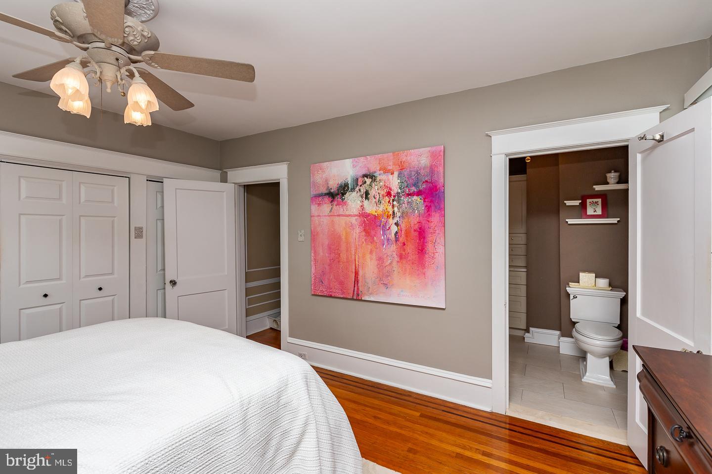 133 Kathmere Road Havertown, PA 19083 - Photo 26 of 45 a spacious bedroom with a bed and a chandelier