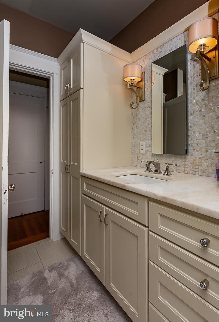 133 Kathmere Road Havertown, PA 19083 - Photo 29 of 45 a bathroom with a sink and a mirror