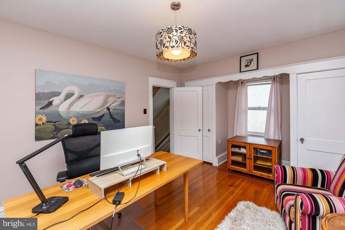 133 Kathmere Road Havertown, PA 19083 - Photo 33 of 45 a bedroom with a bed and a chandelier