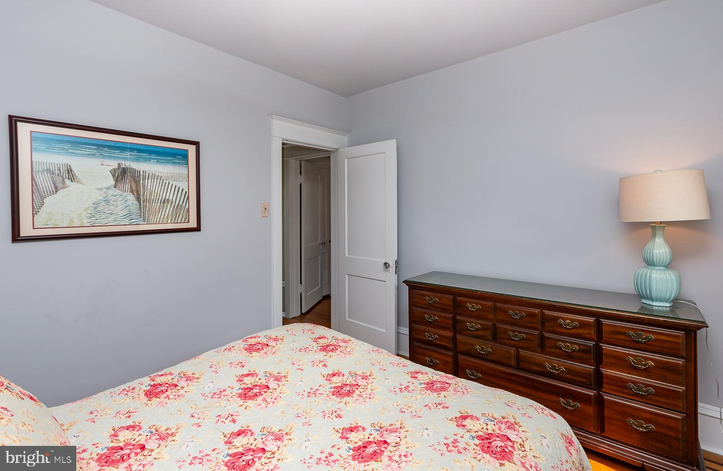 133 Kathmere Road Havertown, PA 19083 - Photo 35 of 45 a bedroom with a bed and a lamp on dresser