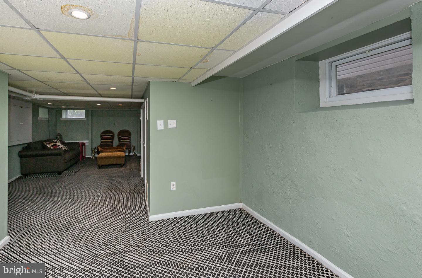 133 Kathmere Road Havertown, PA 19083 - Photo 39 of 45 a view of a livingroom with a car parked on the road