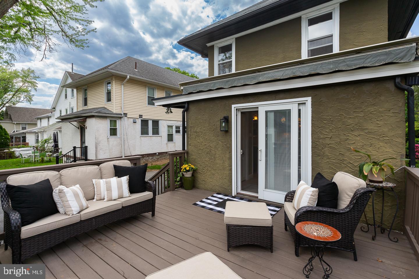 133 Kathmere Road Havertown, PA 19083 - Photo 42 of 45 a view of a patio with couches table and chairs with wooden floor