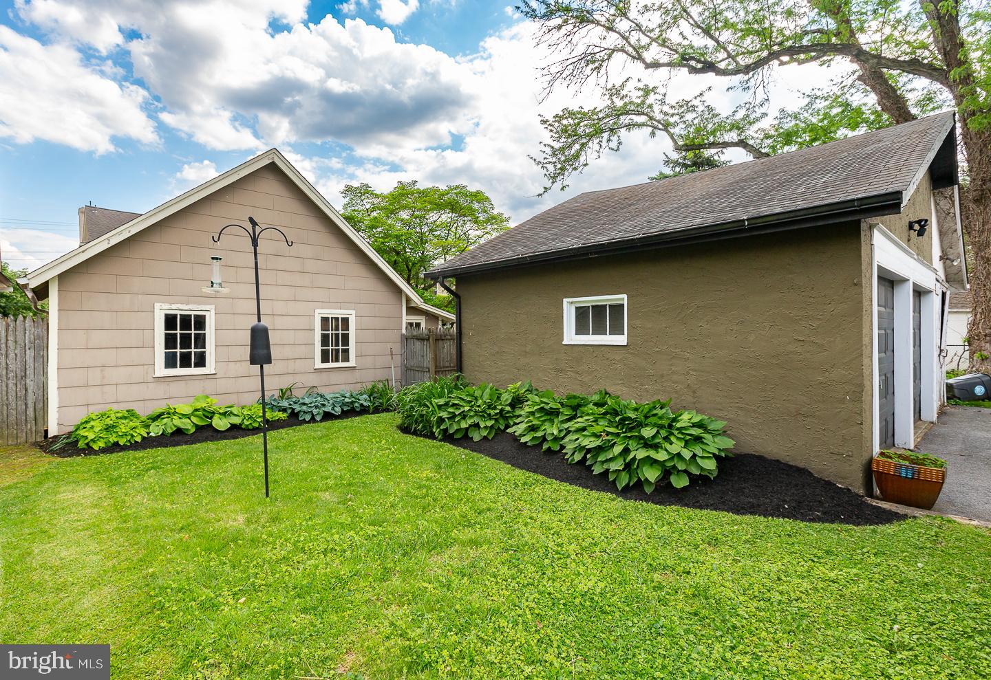 133 Kathmere Road Havertown, PA 19083 - Photo 44 of 45 a view of a house with a yard plants and large tree