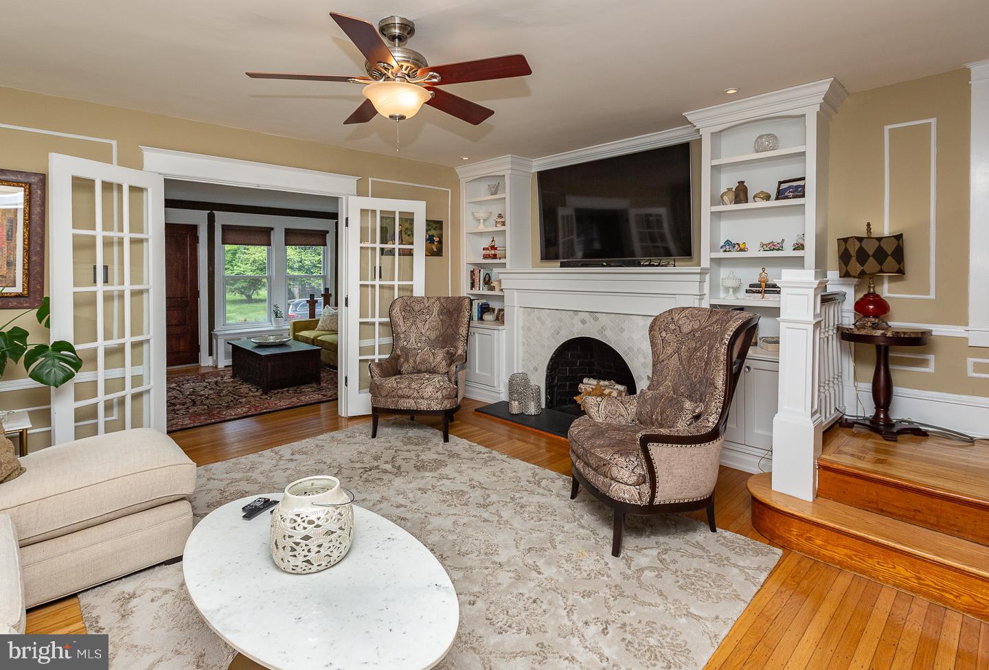 133 Kathmere Road Havertown, PA 19083 - Photo 9 of 45 a living room with furniture a flat screen tv and a fireplace