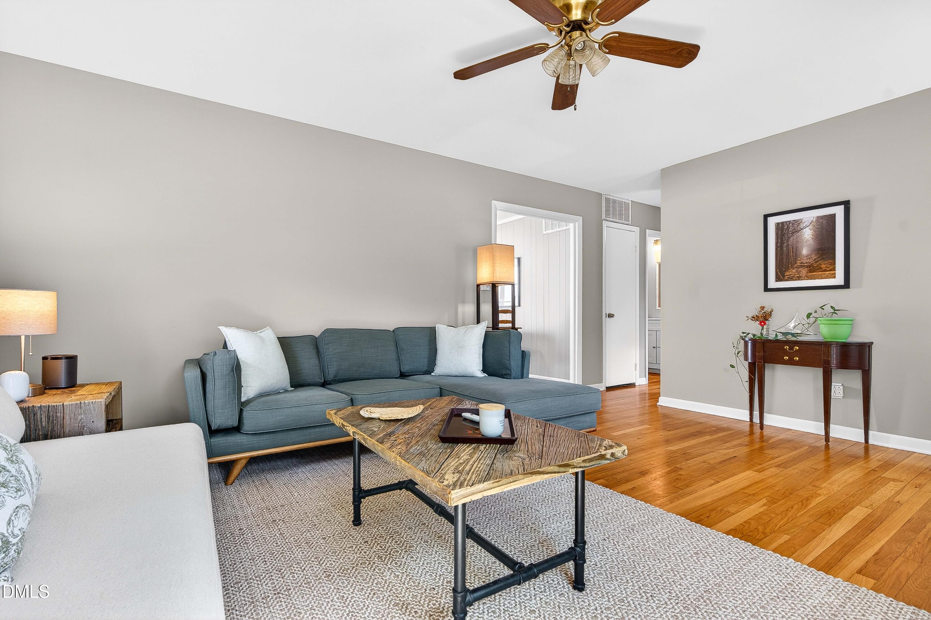 110 Temple Lane Durham, NC 27713 - Photo 5 of 27 a living room with furniture and a wooden floor
