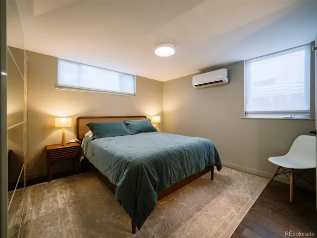 a bedroom with a bed and a table in it