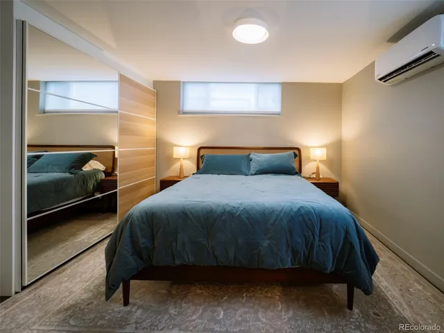 a bedroom with a bed and a walk in closet