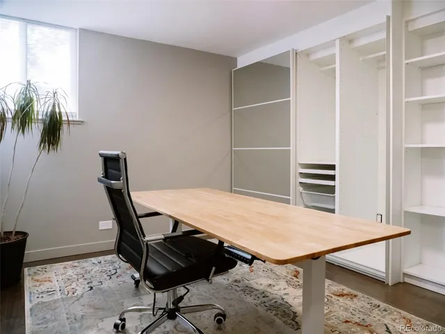 a view of a workspace with furniture