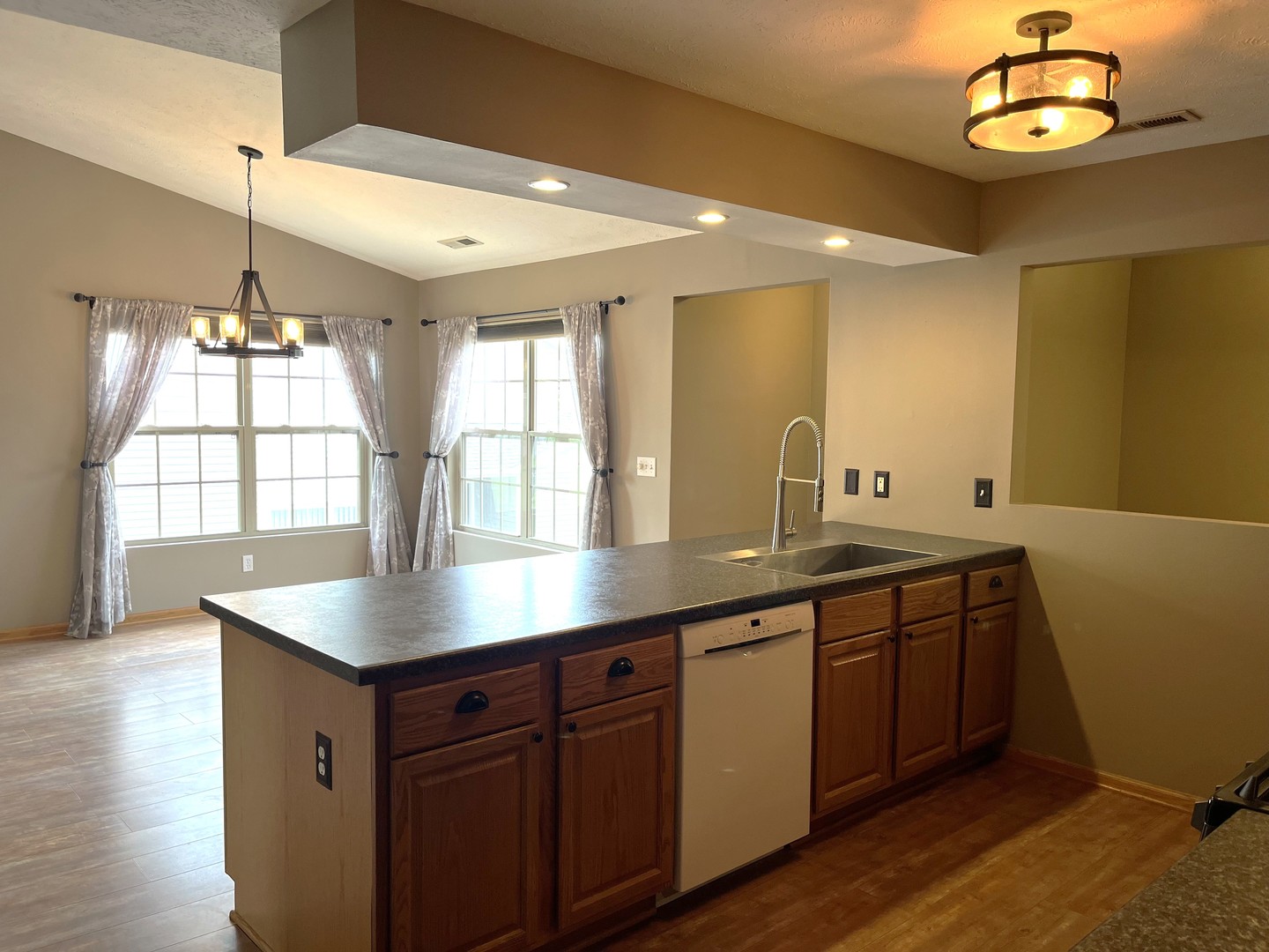 957 Arvle Circle, Unit 957 Sycamore, IL 60178 - Photo 7 of 17 a kitchen with sink and window
