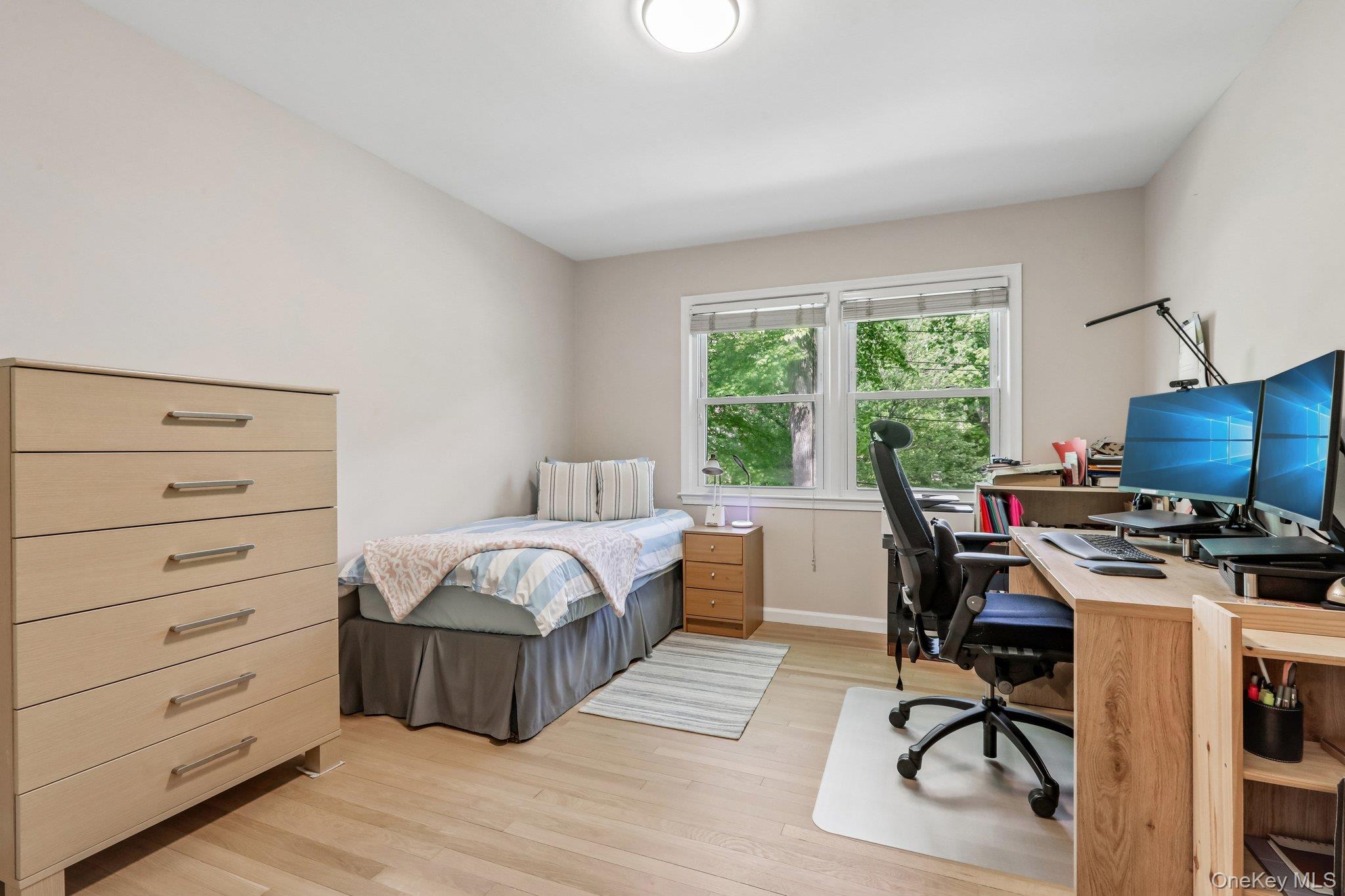 62 Mohegan Road Larchmont, NY 10538 - Photo 35 of 46 a bedroom with a bed and a desk