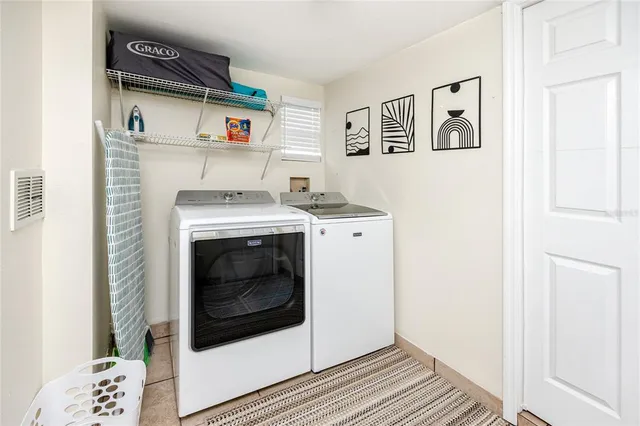 a utility room with dryer and washer
