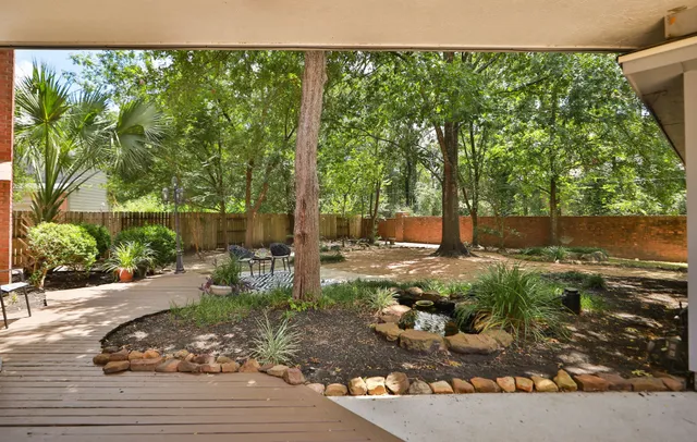 a view of backyard with green space