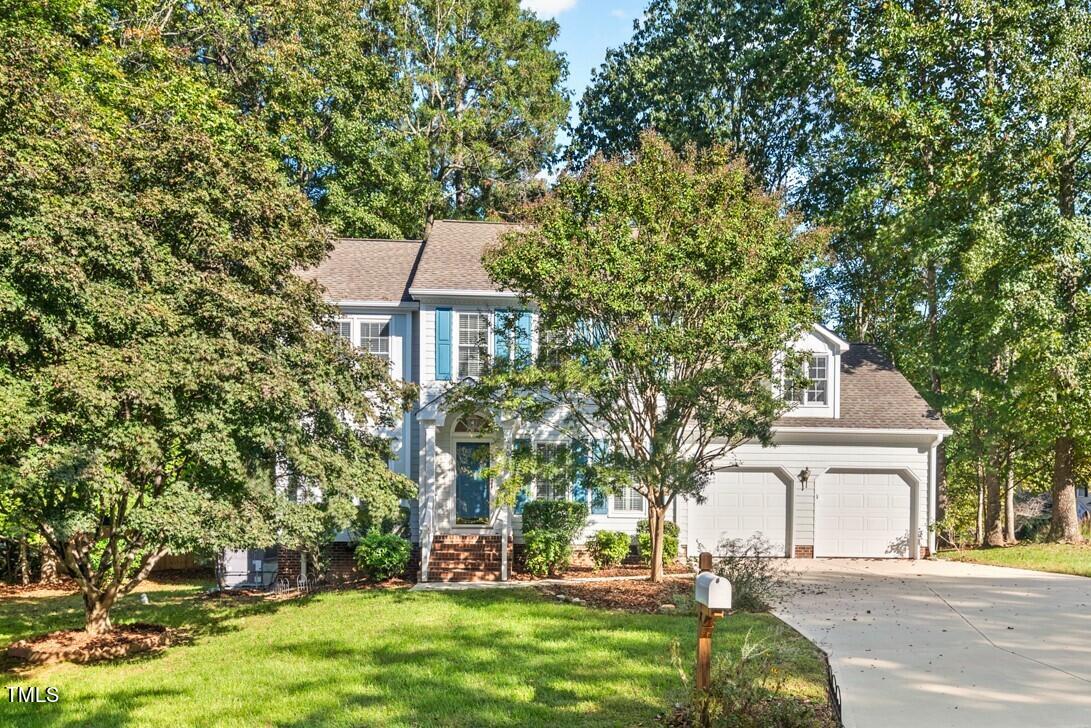 3100 Wilderness Road Durham, NC 27712 - Photo 1 of 35 a front view of a house with a garden