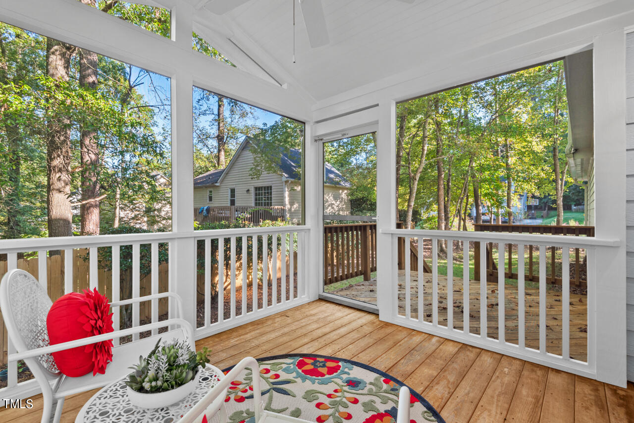 3100 Wilderness Road Durham, NC 27712 - Photo 11 of 35 a balcony with wooden floor and outdoor space