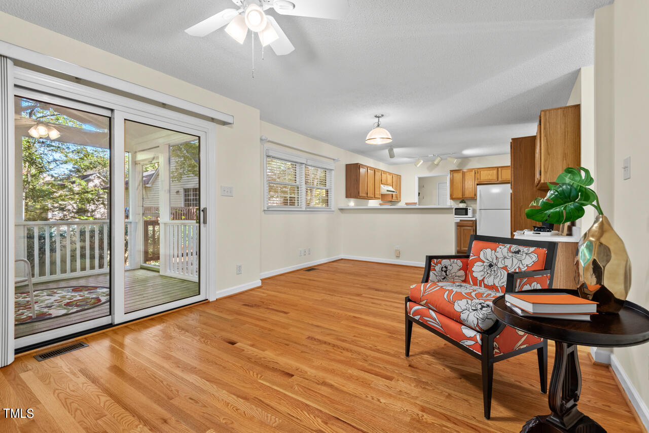 3100 Wilderness Road Durham, NC 27712 - Photo 13 of 35 a living room with furniture and a floor to ceiling window