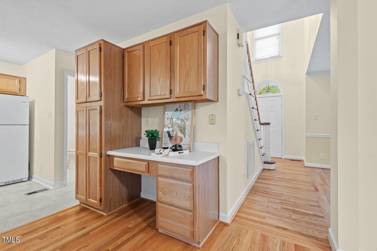 3100 Wilderness Road Durham, NC 27712 - Photo 15 of 35 a kitchen with stainless steel appliances granite countertop a refrigerator and a sink