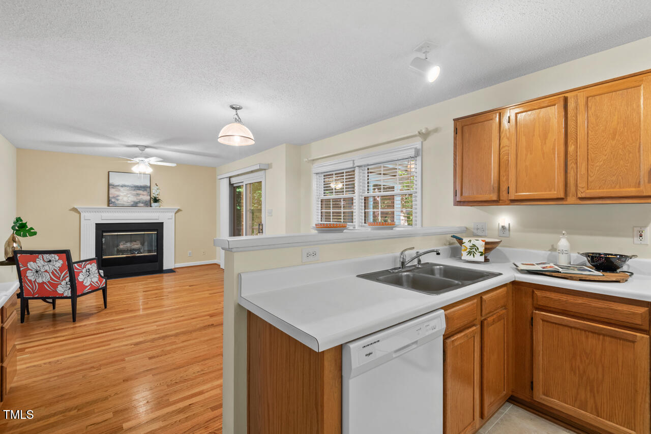 3100 Wilderness Road Durham, NC 27712 - Photo 18 of 35 a kitchen that has a sink and chair