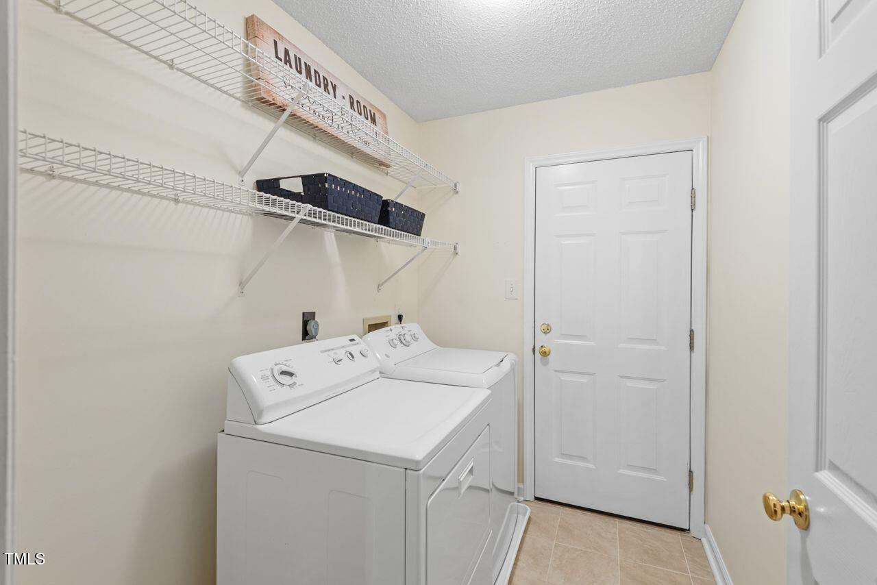 3100 Wilderness Road Durham, NC 27712 - Photo 19 of 35 a utility room with dryer and washer