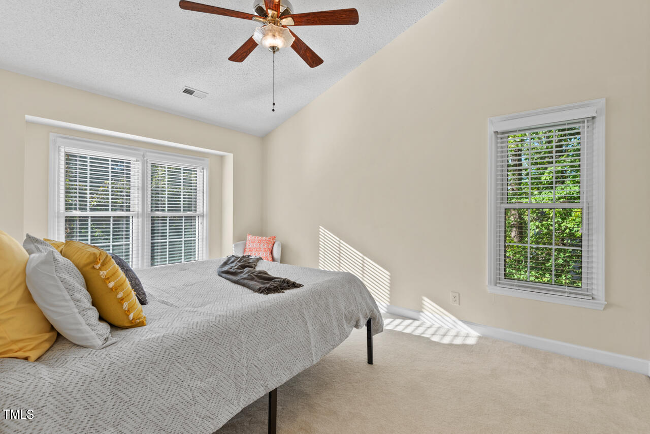3100 Wilderness Road Durham, NC 27712 - Photo 21 of 35 a bedroom with a bed and a window