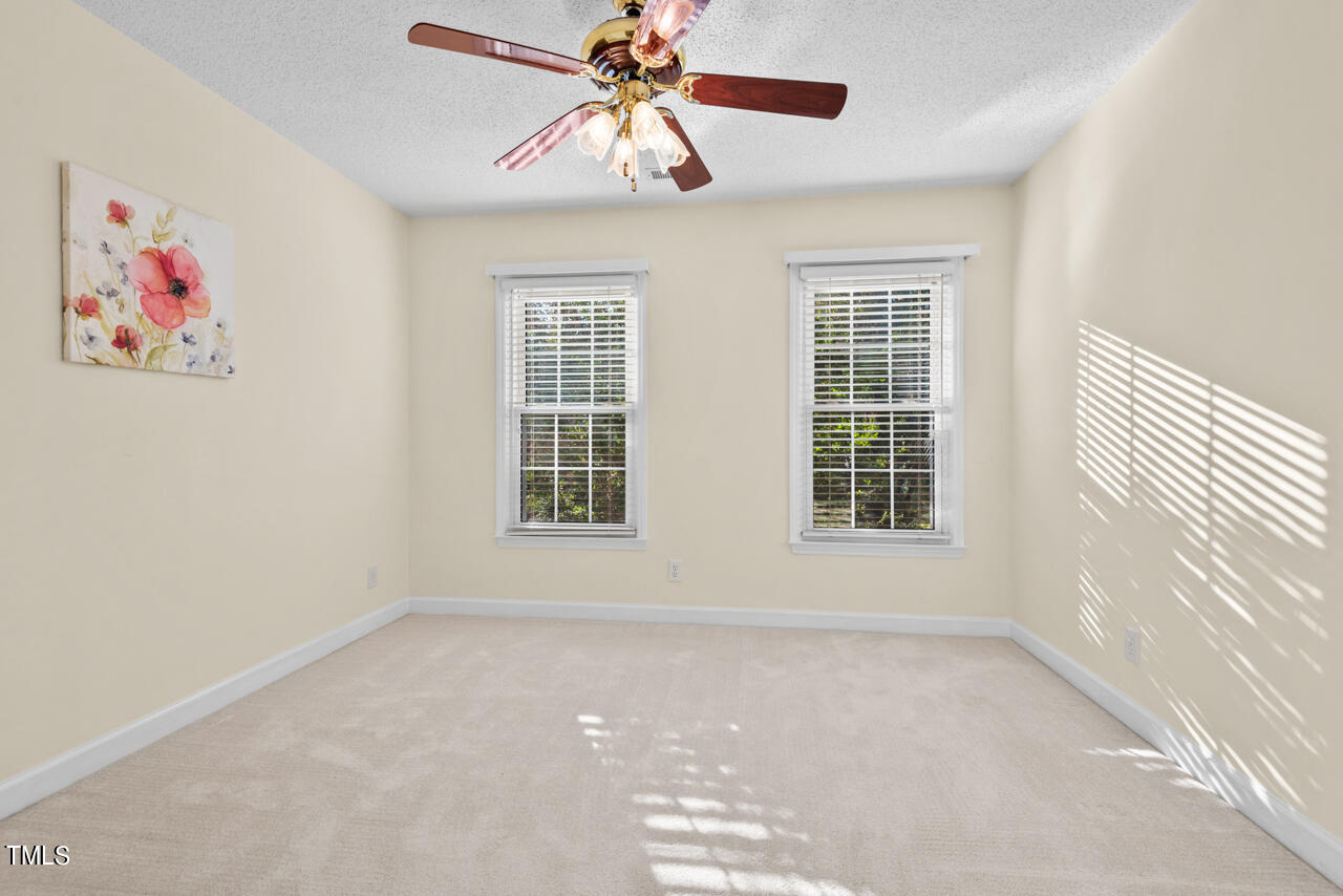 3100 Wilderness Road Durham, NC 27712 - Photo 26 of 35 an empty room with windows and fan