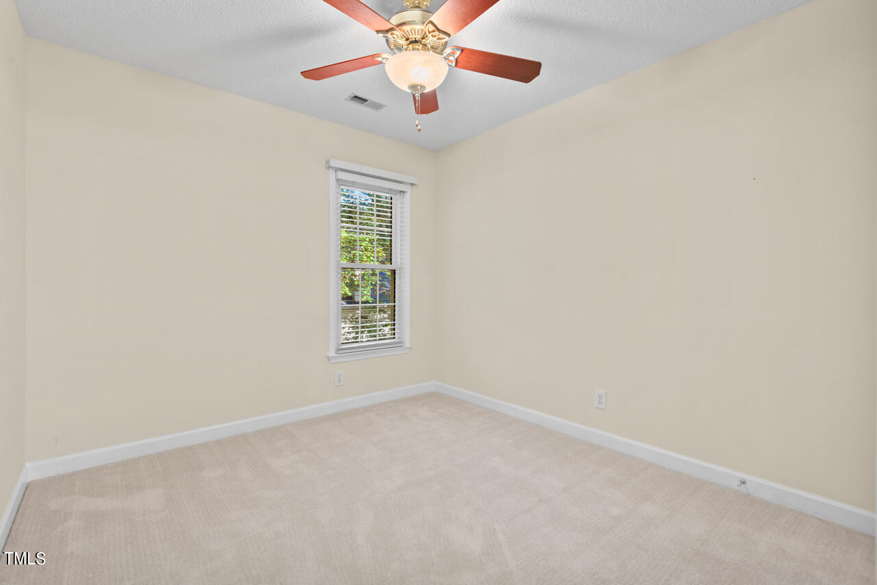 3100 Wilderness Road Durham, NC 27712 - Photo 29 of 35 an empty room with a window and a fan
