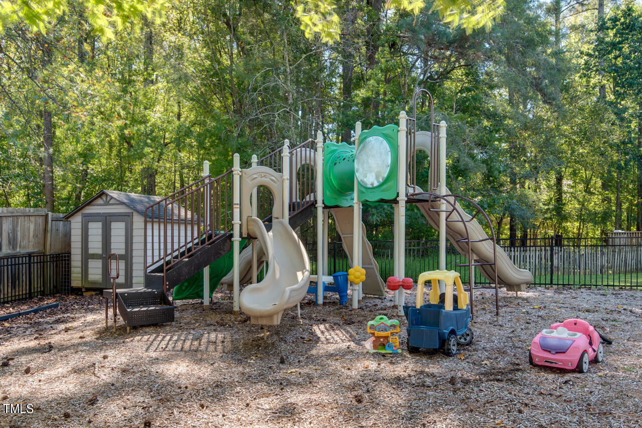 3100 Wilderness Road Durham, NC 27712 - Photo 33 of 35 a view of a chair and tables in the backyard