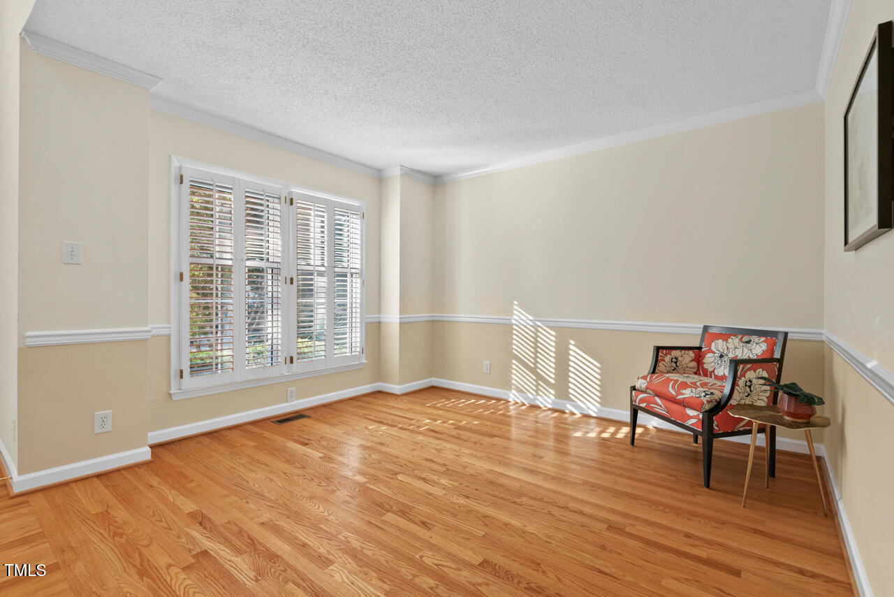 3100 Wilderness Road Durham, NC 27712 - Photo 7 of 35 a view of a room with wooden floor lounge chair and windows
