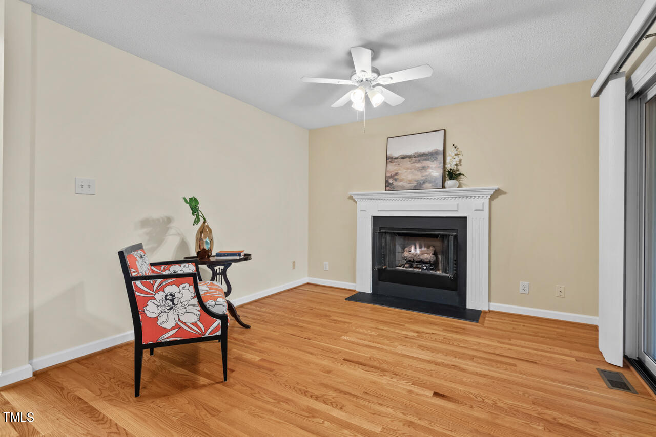 3100 Wilderness Road Durham, NC 27712 - Photo 9 of 35 a view of a livingroom with furniture and a fireplace
