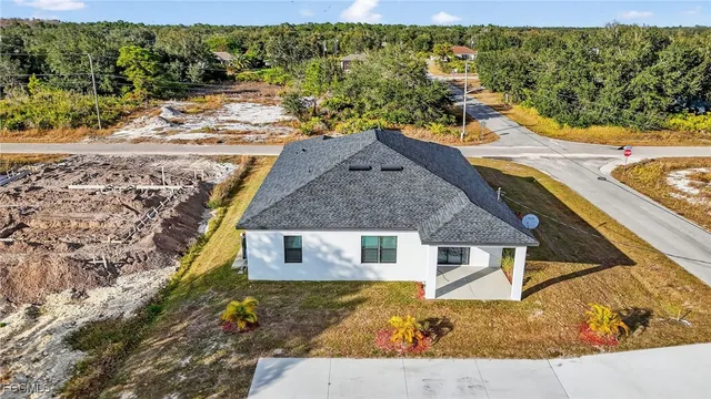 a aerial view of a house with a yard