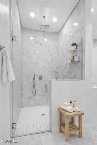a bathroom with a sink a mirror and a shower