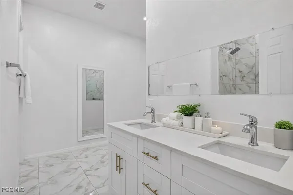 a bathroom with a sink and a mirror
