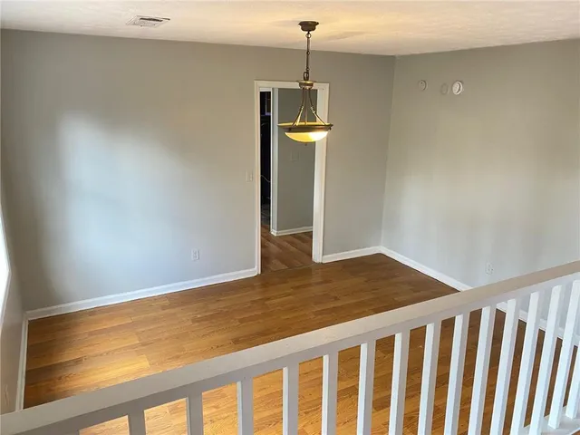 a view of wooden floor and a sink