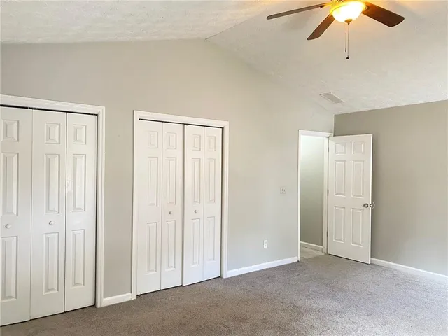 an empty room with closet area