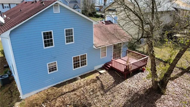 an aerial view of multiple houses with outdoor space