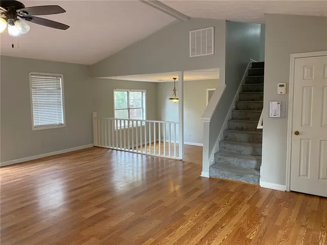 a view of an entryway with wooden floor