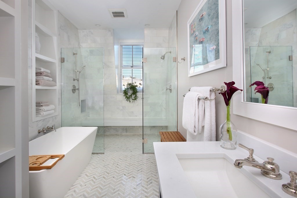 14 Rutland Square Boston, MA 02118 - Photo 11 of 19 a bathroom with a sink a toilet and shower