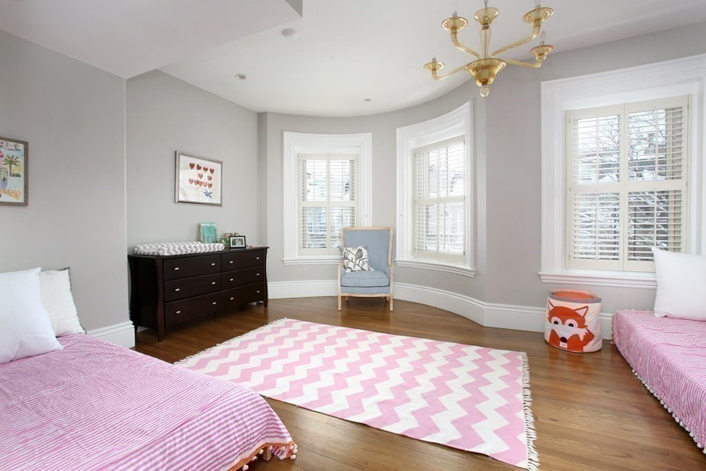 14 Rutland Square Boston, MA 02118 - Photo 14 of 19 a bedroom with a bed dresser and wooden floor