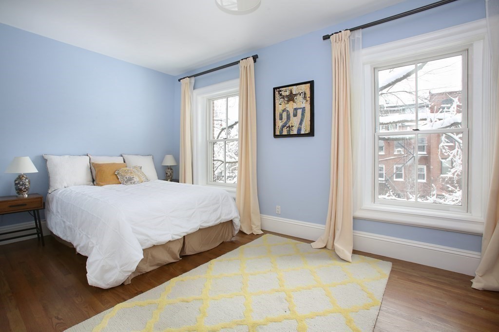 14 Rutland Square Boston, MA 02118 - Photo 16 of 19 a bedroom with a bed and window
