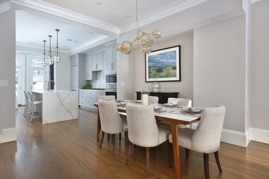 14 Rutland Square Boston, MA 02118 - Photo 2 of 19 a view of a dining room with furniture wooden floor and chandelier