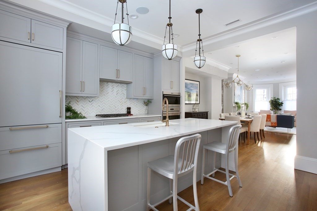14 Rutland Square Boston, MA 02118 - Photo 3 of 19 a kitchen with stainless steel appliances kitchen island a chandelier and refrigerator