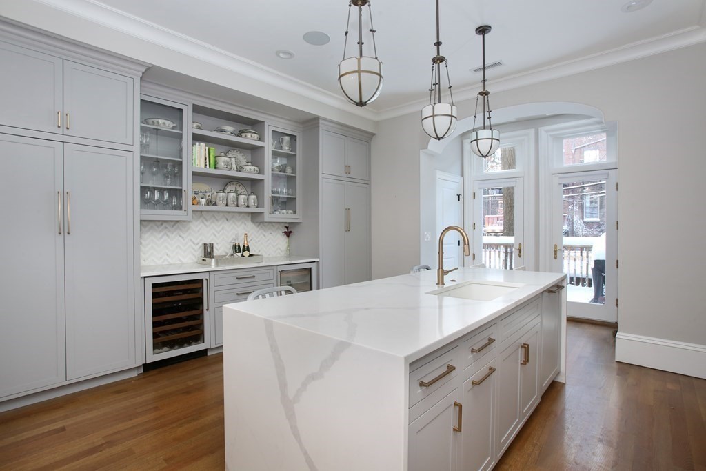 14 Rutland Square Boston, MA 02118 - Photo 4 of 19 a kitchen with stainless steel appliances granite countertop a sink and dishwasher with wooden floor