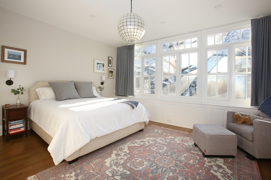 14 Rutland Square Boston, MA 02118 - Photo 10 of 19 a spacious bedroom with a bed and a large window