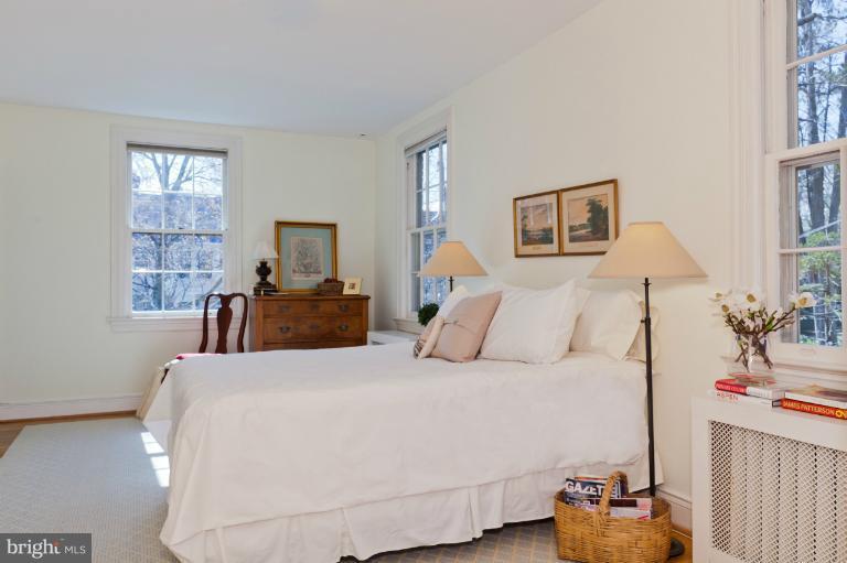 3219 Klingle Road Northwest Washington, DC 20008 - Photo 1 of 30 a bedroom with a bed and wooden floor