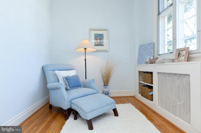 3219 Klingle Road Northwest Washington, DC 20008 - Photo 2 of 30 a living room with furniture and a fireplace
