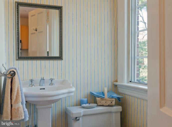 3219 Klingle Road Northwest Washington, DC 20008 - Photo 13 of 30 a bathroom with a sink and a toilet