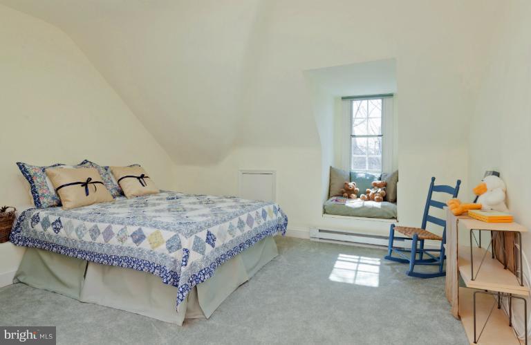 3219 Klingle Road Northwest Washington, DC 20008 - Photo 18 of 30 a spacious bedroom with a bed and a window