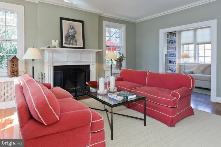 3219 Klingle Road Northwest Washington, DC 20008 - Photo 20 of 30 a living room with furniture and a fireplace