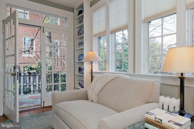 3219 Klingle Road Northwest Washington, DC 20008 - Photo 26 of 30 a living room with furniture and a window